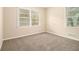 Comfortable bedroom featuring neutral carpeting and two windows providing plenty of natural light at 3500 Finesse Dr, Decatur, GA 30032