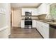 Well-equipped kitchen features white cabinetry, granite counters, and stainless steel appliances at 3500 Finesse Dr, Decatur, GA 30032