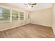 Bright living room with hardwood floors, multiple windows, and a door leading to the outside at 3500 Finesse Dr, Decatur, GA 30032