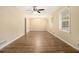 Spacious living room with hardwood floors, large windows for natural light, and a modern ceiling fan at 3500 Finesse Dr, Decatur, GA 30032