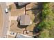 Aerial shot of the property showcasing the roof, fenced backyard, and surrounding neighborhood at 4150 Spring Ridge Dr, Cumming, GA 30028