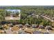 Aerial view of a residential area featuring well-spaced homes surrounded by lush greenery at 4150 Spring Ridge Dr, Cumming, GA 30028