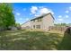 Large, fenced backyard featuring a storage shed, offering privacy and space for recreation at 4150 Spring Ridge Dr, Cumming, GA 30028