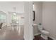 Small bathroom with a pedestal sink and a toilet at 4150 Spring Ridge Dr, Cumming, GA 30028
