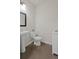 Small bathroom with a pedestal sink, toilet, and a white vanity at 4150 Spring Ridge Dr, Cumming, GA 30028