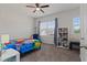 Cozy bedroom with a toy shelf and a view of the outdoors at 4150 Spring Ridge Dr, Cumming, GA 30028