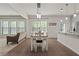 The open-concept living and dining space is filled with natural light at 4150 Spring Ridge Dr, Cumming, GA 30028