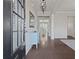 Inviting foyer with hardwood floors and an elegant light fixture at 4150 Spring Ridge Dr, Cumming, GA 30028
