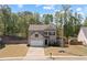 Charming two-story home with a well-maintained lawn, brick accents, and a two-car garage at 4150 Spring Ridge Dr, Cumming, GA 30028