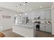 Modern kitchen with stainless steel appliances, gray cabinets, and granite countertops at 4150 Spring Ridge Dr, Cumming, GA 30028
