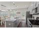 Modern kitchen with stainless steel appliances, gray cabinets, and granite countertops at 4150 Spring Ridge Dr, Cumming, GA 30028