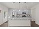 Modern kitchen with stainless steel appliances, gray cabinets, and granite countertops at 4150 Spring Ridge Dr, Cumming, GA 30028