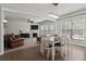 Open-concept living room and dining room featuring a fireplace at 4150 Spring Ridge Dr, Cumming, GA 30028