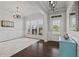 Bright living room with large windows, hardwood floors, and elegant decor at 4150 Spring Ridge Dr, Cumming, GA 30028
