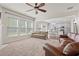 Spacious living room with hardwood flooring, large windows, and comfortable seating at 4150 Spring Ridge Dr, Cumming, GA 30028
