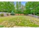 Expansive backyard with lush green grass and partial wood fencing at 1026 Towne Mill Xing, Canton, GA 30114