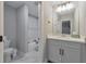 Neutral bathroom featuring a single vanity, a full tub/shower, and modern fixtures at 1026 Towne Mill Xing, Canton, GA 30114
