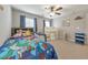 Playful bedroom with plenty of natural light, a ceiling fan, and a vibrant Toy Story themed bed at 1026 Towne Mill Xing, Canton, GA 30114