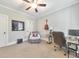 A serene bedroom offering a comfortable recliner with an airborne throw and a study desk at 1026 Towne Mill Xing, Canton, GA 30114