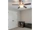 Neutral-toned room featuring a built in bookshelf, a television, and white doors at 1026 Towne Mill Xing, Canton, GA 30114