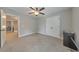 Neutral bedroom featuring plush carpeting, a ceiling fan, and a closet for ample storage at 1026 Towne Mill Xing, Canton, GA 30114