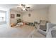 Spacious bonus room offering plush carpeting, ceiling fan, and natural light at 1026 Towne Mill Xing, Canton, GA 30114