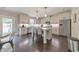 Modern kitchen with white cabinets, stainless steel appliances, an island, and hardwood floors at 1026 Towne Mill Xing, Canton, GA 30114