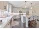 Bright kitchen with white cabinets, granite countertops, stainless appliances, and a kitchen island at 1026 Towne Mill Xing, Canton, GA 30114