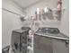 Convenient laundry room with newer model washer and dryer and wire shelving at 1026 Towne Mill Xing, Canton, GA 30114