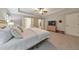 Elegant main bedroom with tray ceiling, ceiling fan, and large windows to allow for plenty of natural light at 1026 Towne Mill Xing, Canton, GA 30114