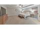 Spacious main bedroom with a tray ceiling, complemented by large windows and a modern ceiling fan at 1026 Towne Mill Xing, Canton, GA 30114