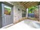 Backyard patio with exterior access door and partial overhead covering at 215 Arizona Ne Ave # 6, Atlanta, GA 30307