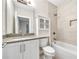 Modern bathroom featuring a shower-tub combo, white vanity, and wall cabinet at 215 Arizona Ne Ave # 6, Atlanta, GA 30307