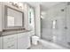 Stylish bathroom with gray vanity, quartz countertop, modern fixtures, and a large shower with glass door at 215 Arizona Ne Ave # 6, Atlanta, GA 30307