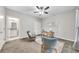 Bright bedroom features a ceiling fan, cozy chairs, and a wooden desk at 215 Arizona Ne Ave # 6, Atlanta, GA 30307
