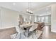 Bright dining area featuring modern lighting, an island with a countertop, and hardwood flooring at 215 Arizona Ne Ave # 6, Atlanta, GA 30307