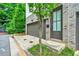 Charming townhome with a brick facade, attached garage, and inviting entrance with new landscaping at 215 Arizona Ne Ave # 6, Atlanta, GA 30307