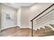 Welcoming foyer featuring hardwood floors, modern staircase, and a bright entryway with natural light at 215 Arizona Ne Ave # 6, Atlanta, GA 30307