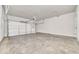 Spacious two car garage features a large garage door and white walls at 215 Arizona Ne Ave # 6, Atlanta, GA 30307