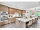 Open kitchen with island seating, stainless steel appliances, and seamless flow into the adjacent living space at 215 Arizona Ne Ave # 6, Atlanta, GA 30307
