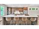 Modern kitchen features stainless steel appliances, an island with seating, and ample cabinet space at 215 Arizona Ne Ave # 6, Atlanta, GA 30307