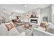 Open-concept living space features a cozy fireplace and flows seamlessly into the dining and kitchen areas at 215 Arizona Ne Ave # 6, Atlanta, GA 30307