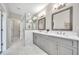 Modern main bathroom featuring gray cabinets, double vanity, quartz countertop, and walk-in glass shower at 215 Arizona Ne Ave # 6, Atlanta, GA 30307