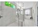 Beautiful main bathroom with stand-alone tub, marble shower, and windows allowing natural light to enter at 215 Arizona Ne Ave # 6, Atlanta, GA 30307