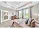 Spacious main bedroom with large windows, tray ceiling, ceiling fan, and ensuite bathroom with a double vanity at 215 Arizona Ne Ave # 6, Atlanta, GA 30307