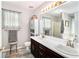 Bathroom with dual sinks, white countertop, and a large vanity at 65 Macadamia Ct, Covington, GA 30016