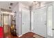 Bright foyer with hardwood floors, white doors, and ample natural light flowing into the home at 65 Macadamia Ct, Covington, GA 30016