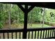Relaxing balcony view overlooking a lush green space with mature trees at 6503 Old Macon Hwy, Rex, GA 30273