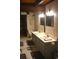 Bathroom featuring double sinks and vanity with updated fixtures at 6503 Old Macon Hwy, Rex, GA 30273