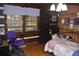 Cozy bedroom with wood paneled walls and a comfortable bed at 6503 Old Macon Hwy, Rex, GA 30273